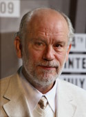 John Malkovich, an atypical actor suffering from natural schizophrenia, according to film reviewers. For a long time, he turned down all offers for commercial roles. He became a star against his will, for instance in the role of the heir to the throne of France in Joan of Arc directed by Besson. His natal chart is quite difficult with a Moon-Saturn square, a Uranus-Mars square, and Pluto in the 12th House square Mercury in the 3rd House, but also with a blazing Jupiter on the MC trine Mars, which indicates action towards glory despite the Sun's opposition.